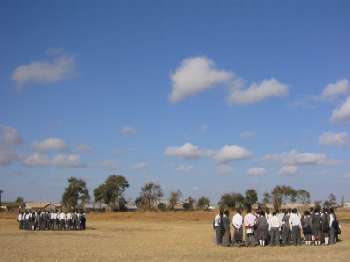 Groups of students on a soccer field