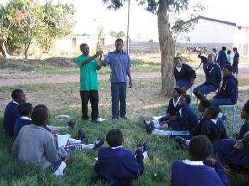 CE volunteers discuss HIV with students.