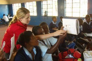 Students projecting images using a lens.