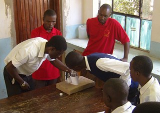 A student showing his colleagues his work